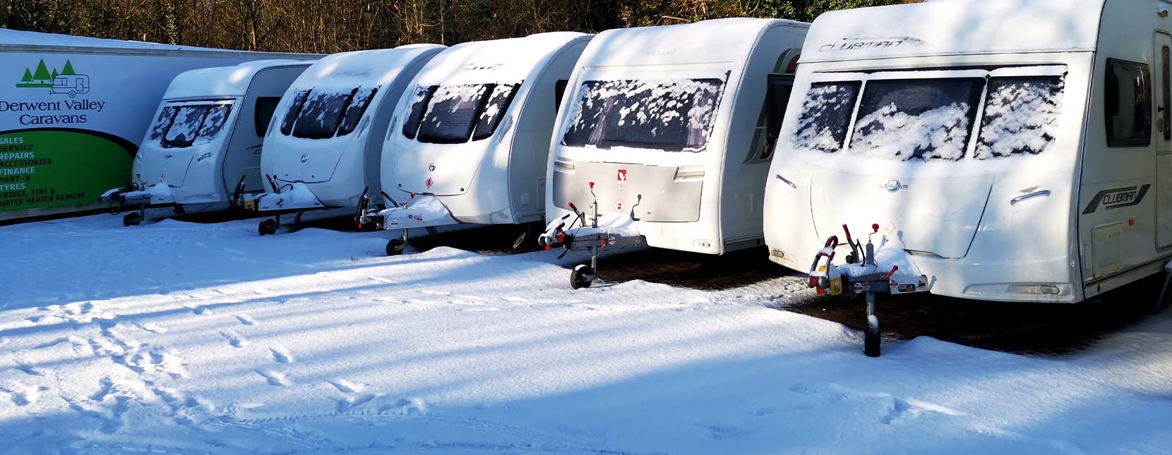 Caravans with snow covering at Derwent Valley Caravans